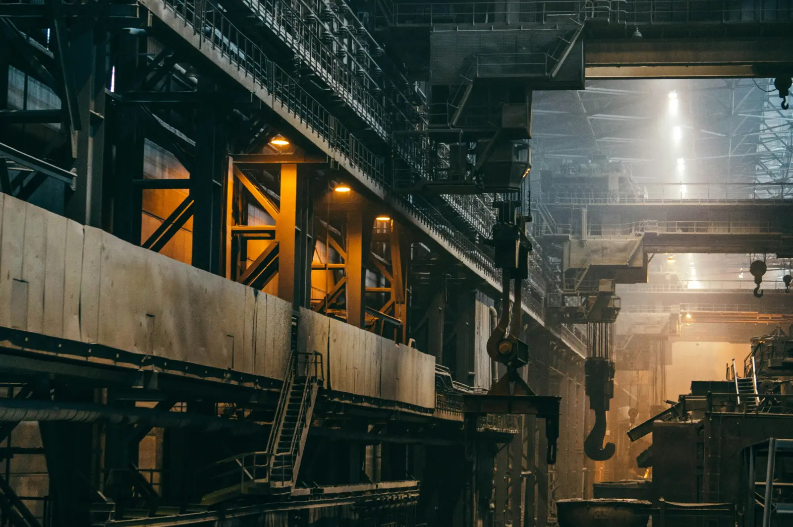 Industrial processing plant with steel structures at dusk